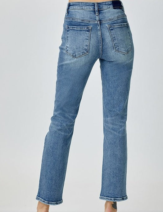 model wearing slim straight leg jeans