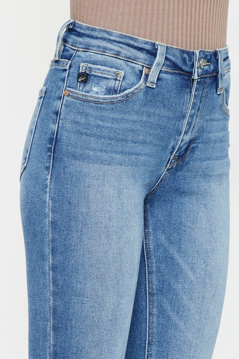 model wearing medium wash bootcut jeans