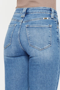 model wearing medium wash bootcut jeans