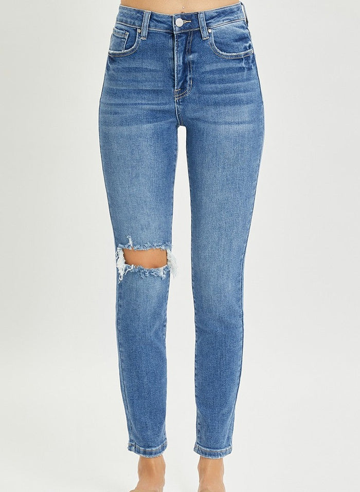 model wearing distressed skinny jeans