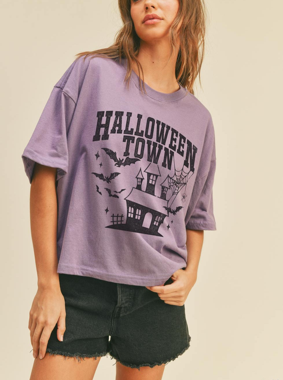 model wearing a purple halloween tee
