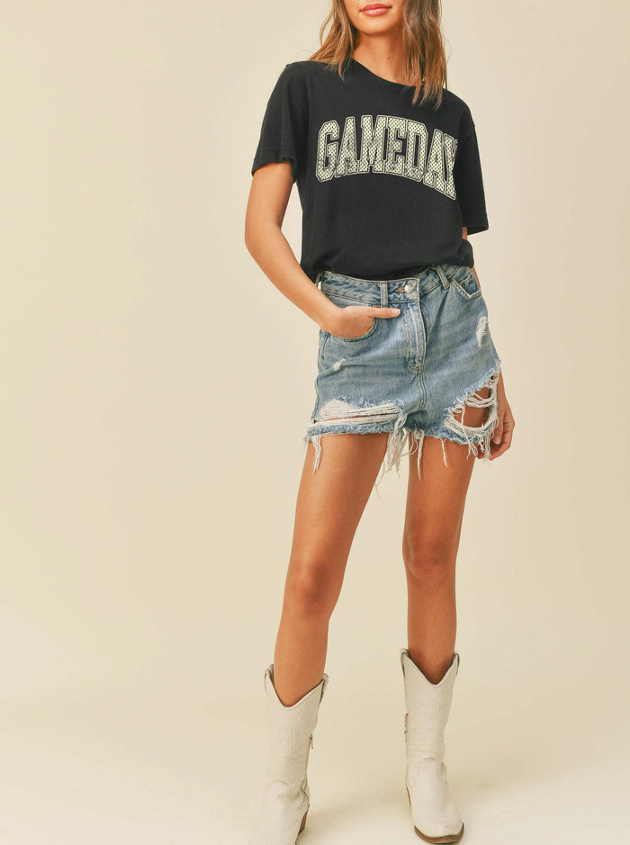 model wearing a black game day tee